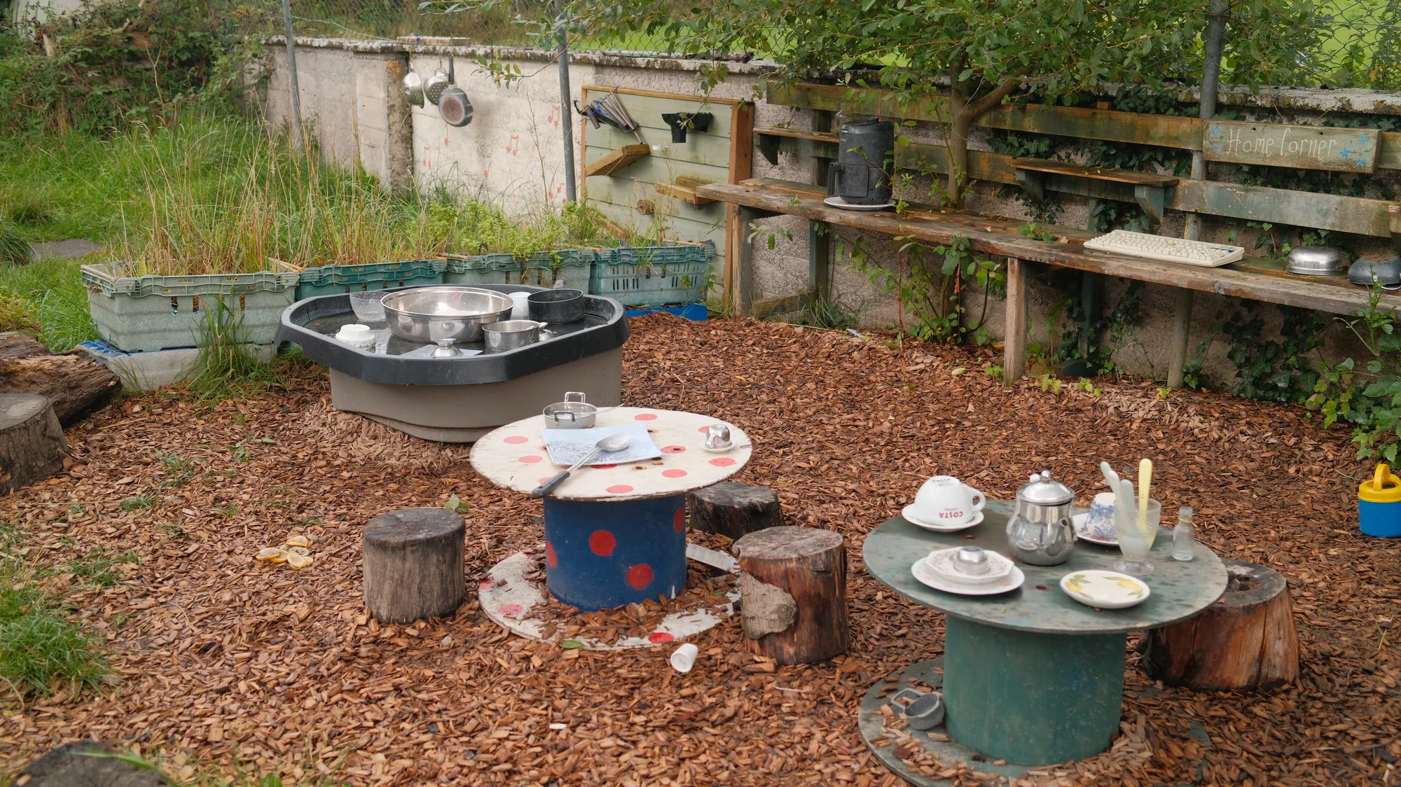 Round outdoor tables and a tyre table in the garden