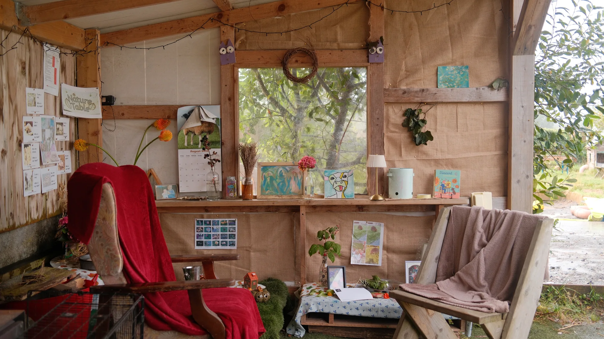 Chairs, blankets and artwork in the reading corner